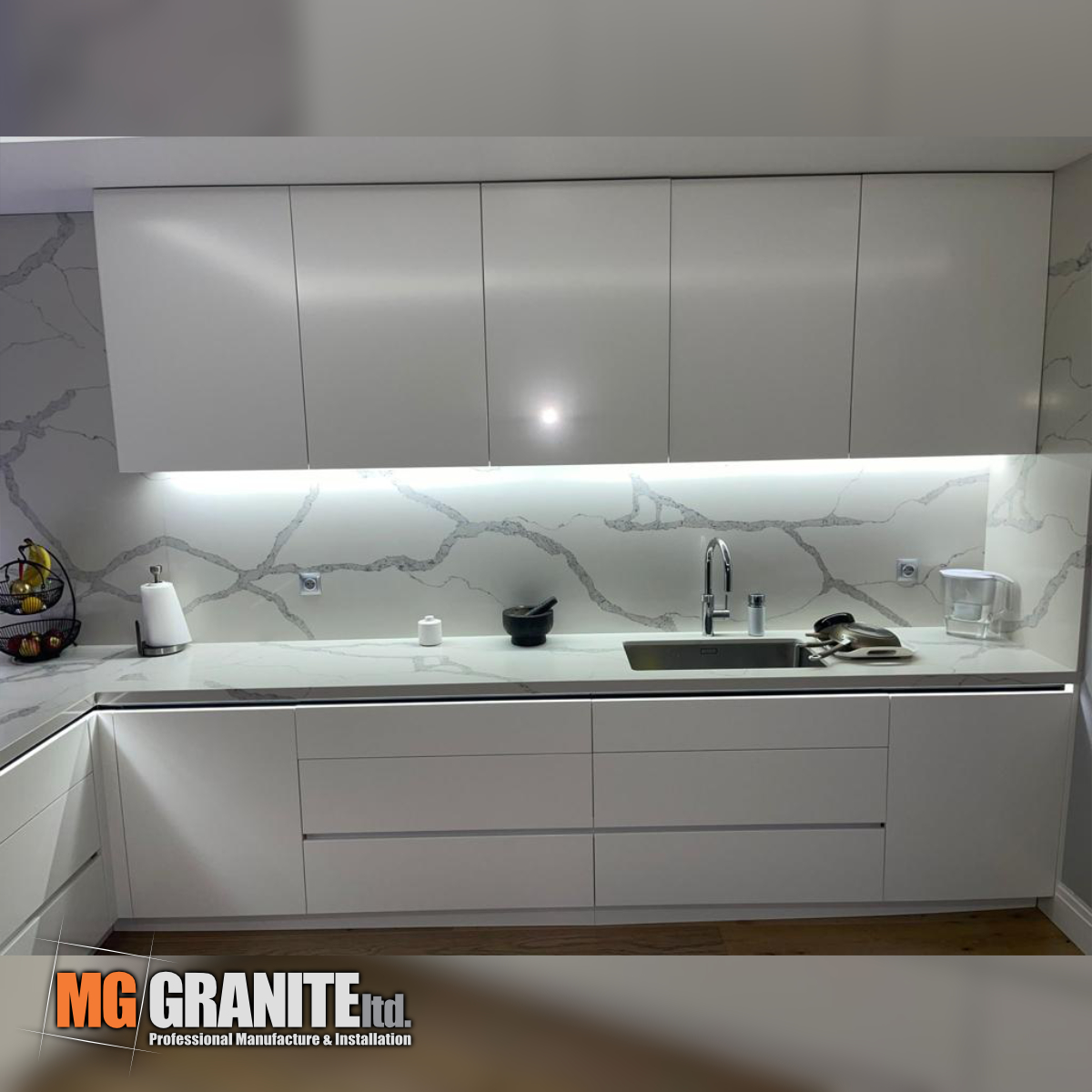 White Quartz with grey veins worktops - full kitchen