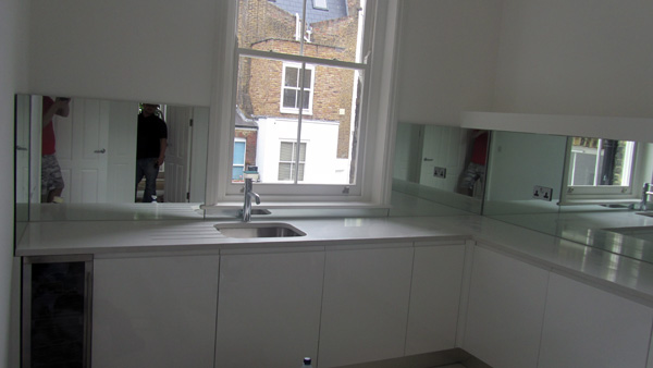 Quartz kitchen worktops and mirror glass splashbacks Fulham