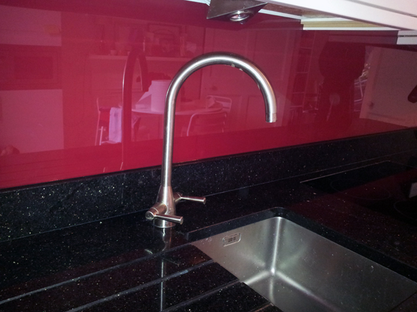 Red Glass Splash Back and Star Galaxy Granite Kitchen Worktop Farringdon