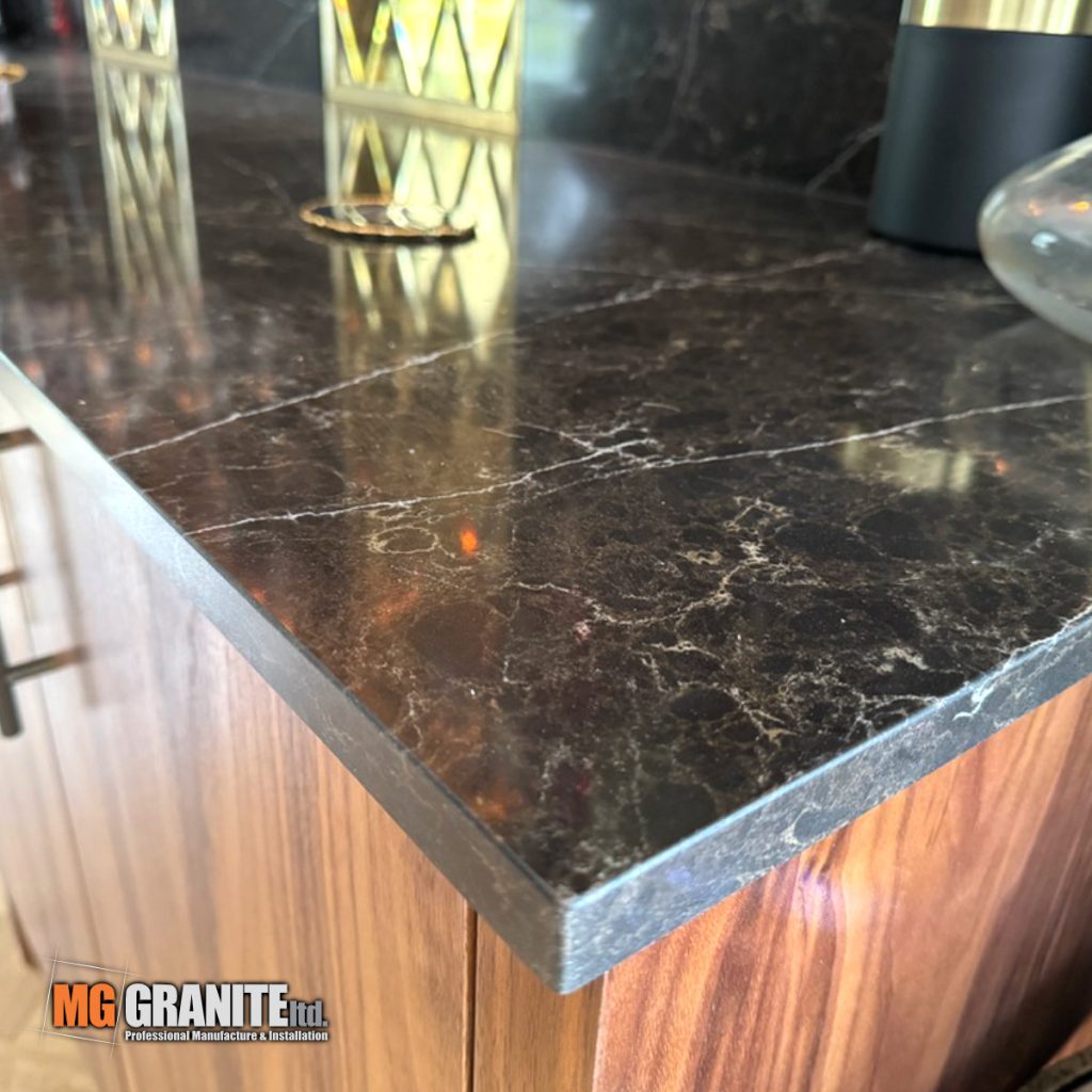 Detailed shot of the precision-fitted bar top in Planet Earth quartz.