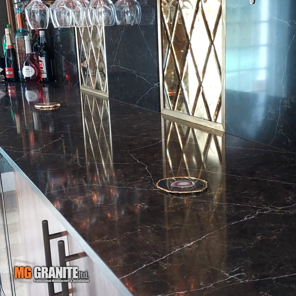 Close-up of the joinery and chamfered edges on the quartz feature wall.